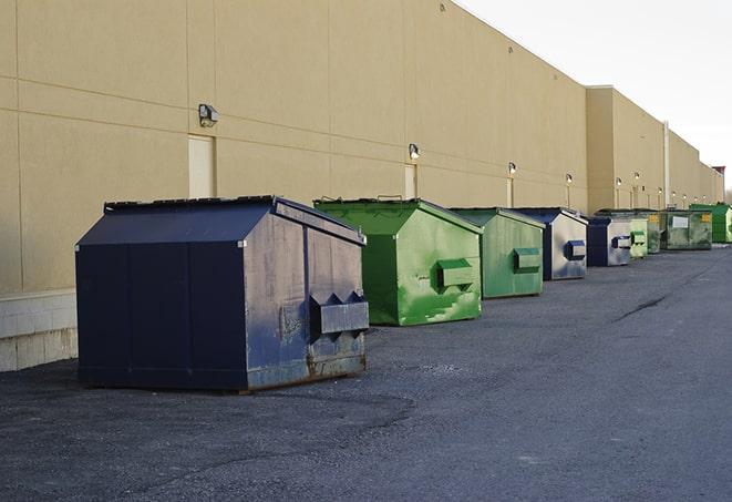 construction dumpsters on a worksite surrounded by caution tape in Paulding, OH